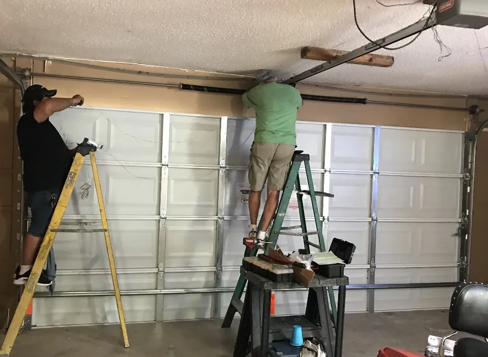 Close-up of a garage door with design pressure rating label at a Florida construction site